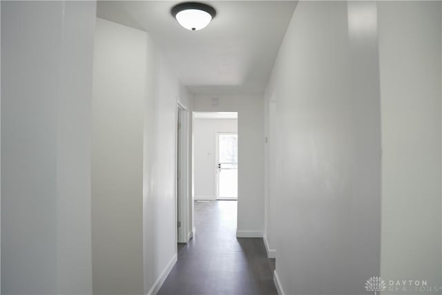 hall with dark hardwood / wood-style floors