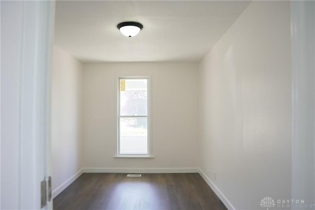 empty room featuring dark hardwood / wood-style floors