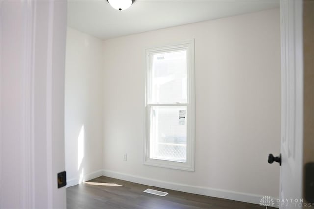 empty room featuring dark hardwood / wood-style floors