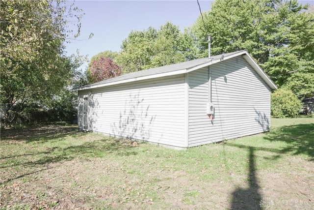 view of outdoor structure featuring a lawn