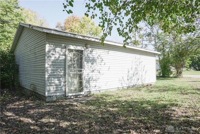 view of home's exterior with a yard