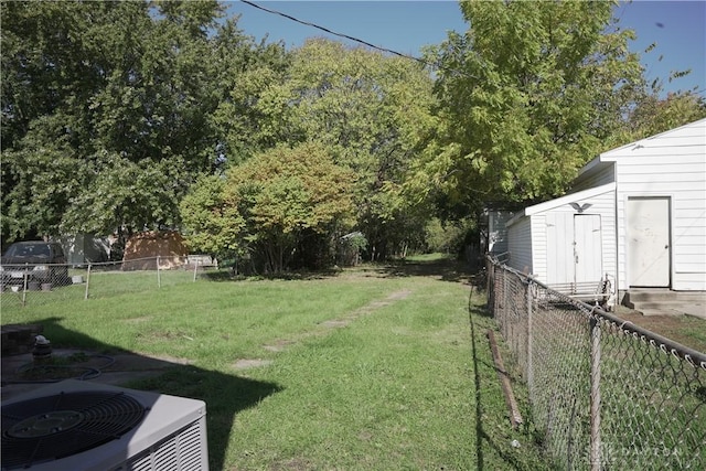 view of yard featuring central air condition unit