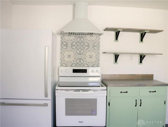 kitchen with white appliances, exhaust hood, and green cabinets