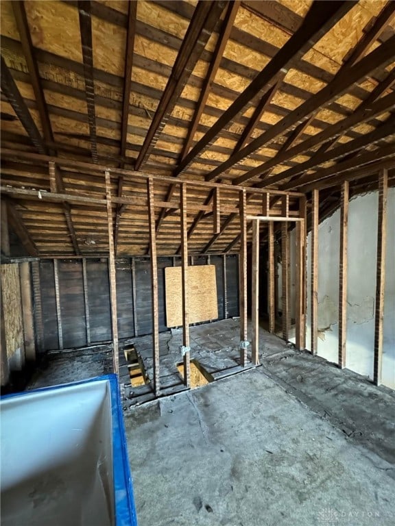 miscellaneous room featuring lofted ceiling