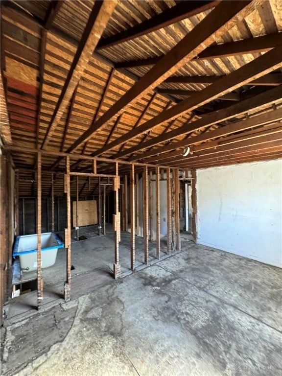 miscellaneous room with lofted ceiling