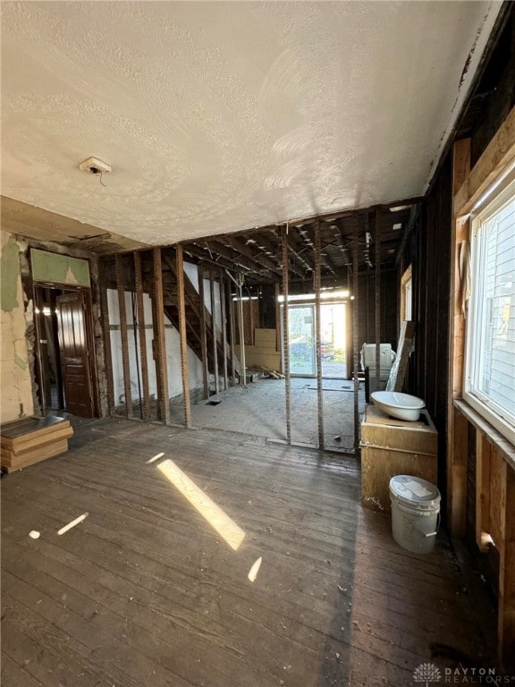 misc room with dark hardwood / wood-style flooring and plenty of natural light