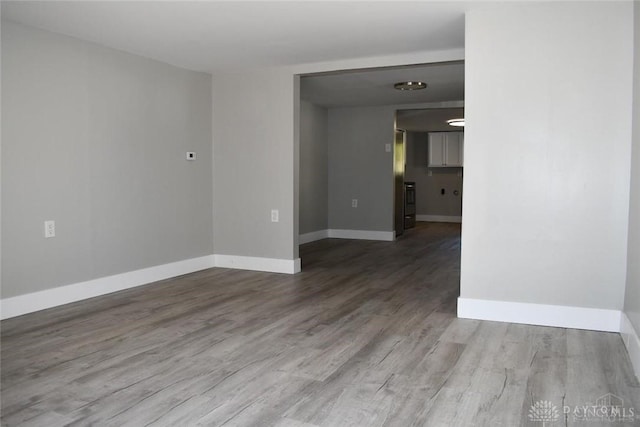 spare room featuring light wood-type flooring