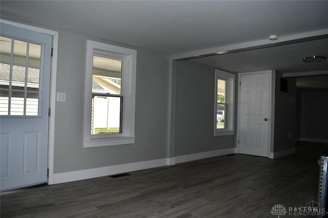 unfurnished room with dark hardwood / wood-style floors