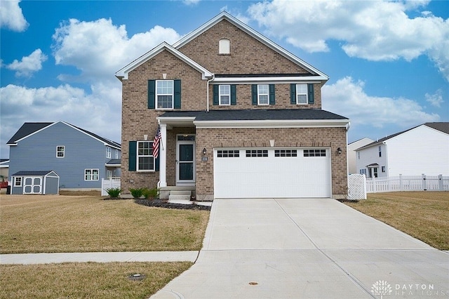 view of front property featuring a garage and a front lawn