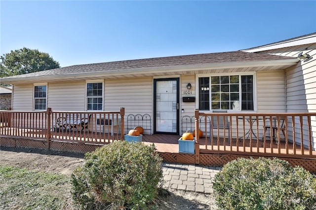 doorway to property featuring a deck