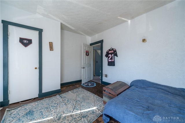 bedroom featuring a textured ceiling and visible vents