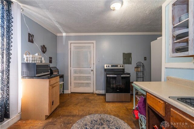 kitchen featuring stainless steel appliances and a textured ceiling