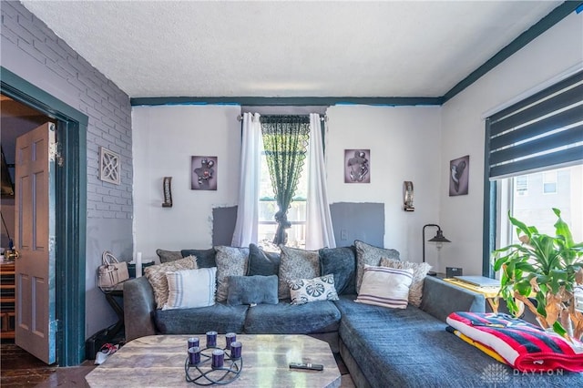 living area featuring a textured ceiling