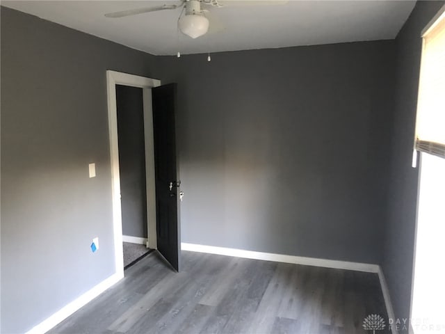 empty room featuring ceiling fan and hardwood / wood-style flooring