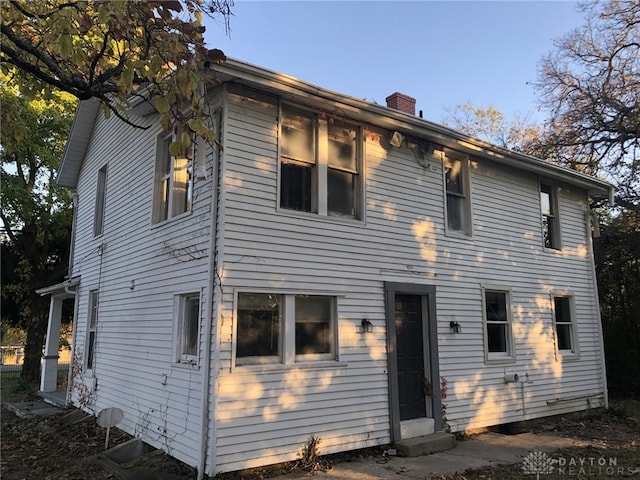 view of front of house with a chimney