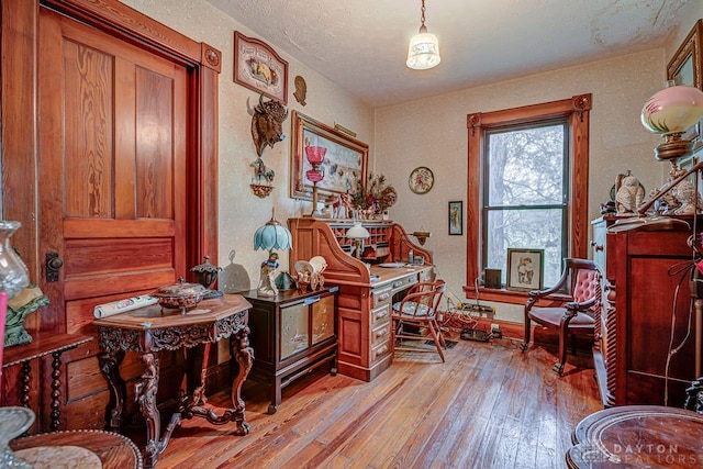 living area with light hardwood / wood-style flooring