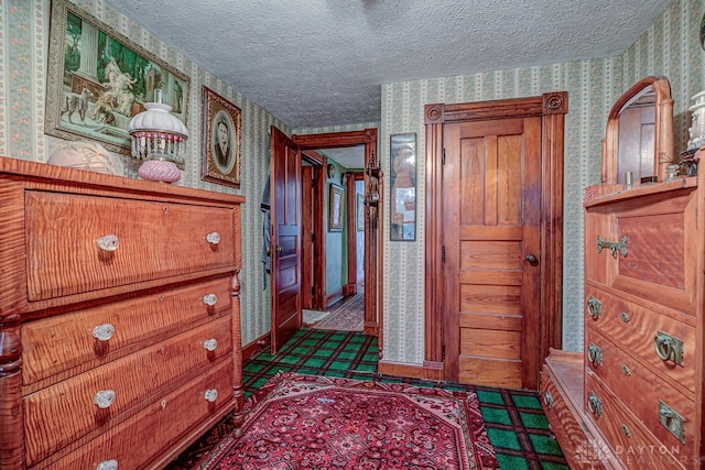 hallway featuring a textured ceiling