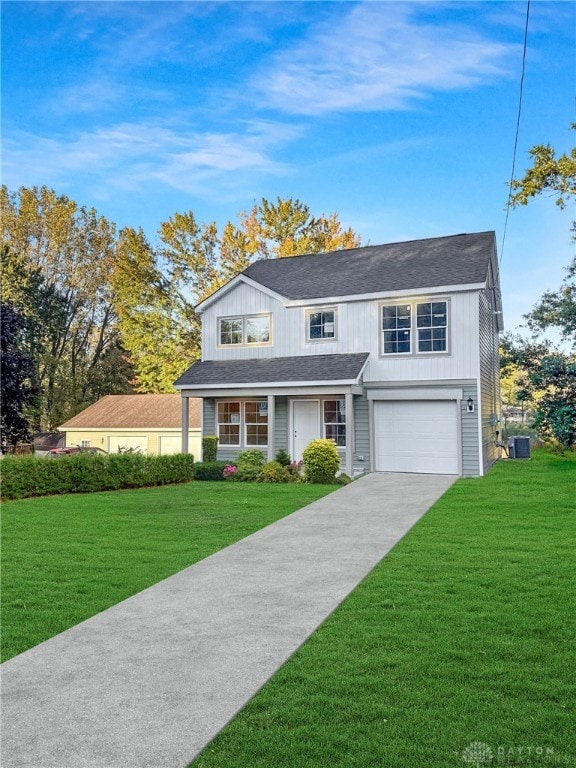 front facade with a front yard, central AC, and a garage