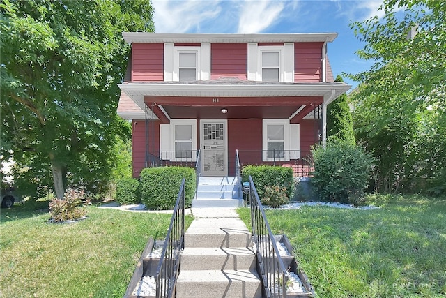 view of front facade featuring a porch and a front yard