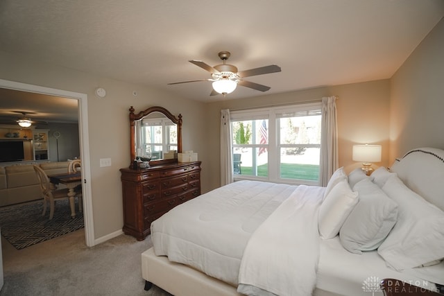 carpeted bedroom with multiple windows and ceiling fan