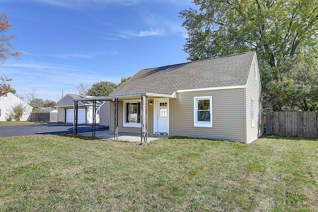 view of front of house with a garage and a front lawn