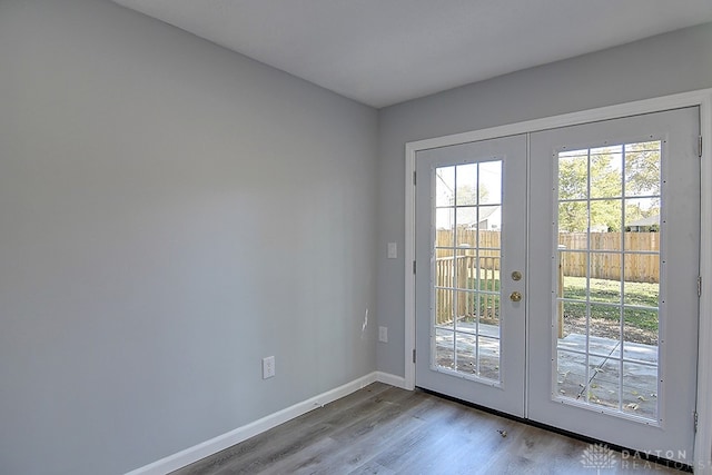 doorway with light hardwood / wood-style flooring and french doors