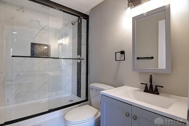 full bathroom featuring vanity, toilet, and bath / shower combo with glass door