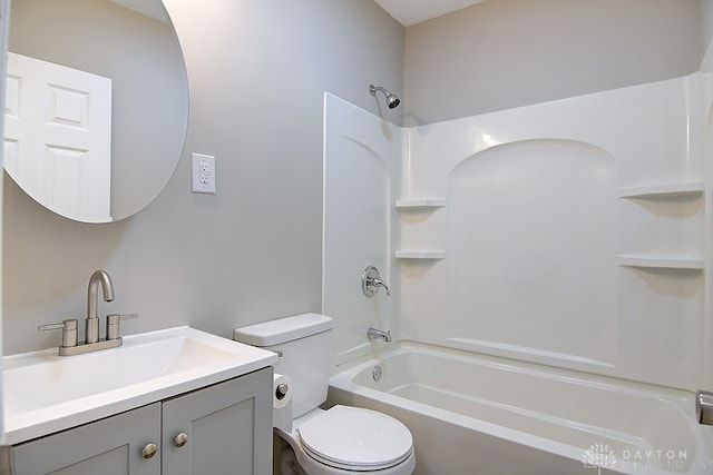 full bathroom featuring toilet, vanity, and bathing tub / shower combination