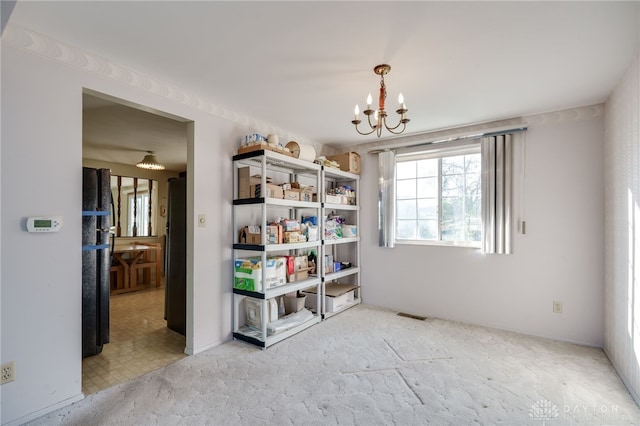 empty room with a notable chandelier