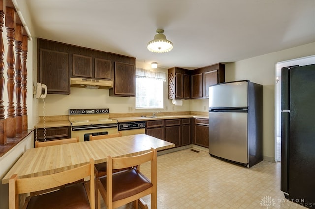 kitchen with stainless steel fridge, dark brown cabinets, black refrigerator, electric stove, and sink