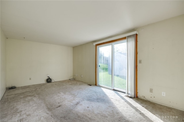 empty room featuring light colored carpet