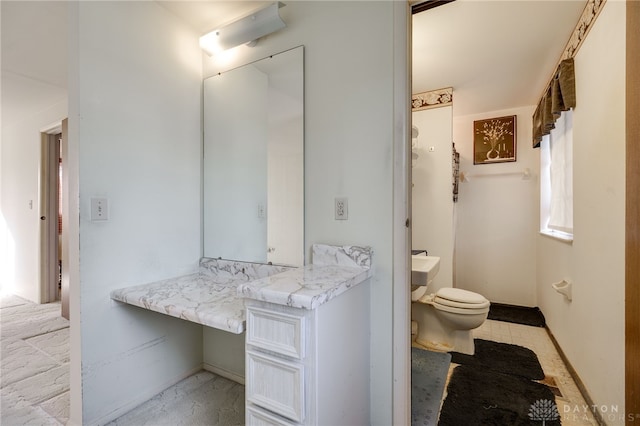 bathroom with vanity and toilet