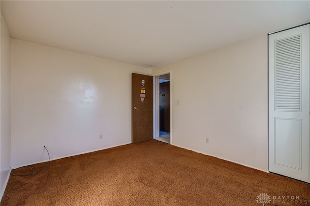 unfurnished bedroom with carpet flooring