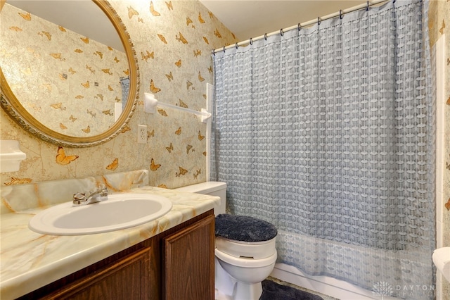 full bathroom featuring vanity, toilet, and shower / bath combo