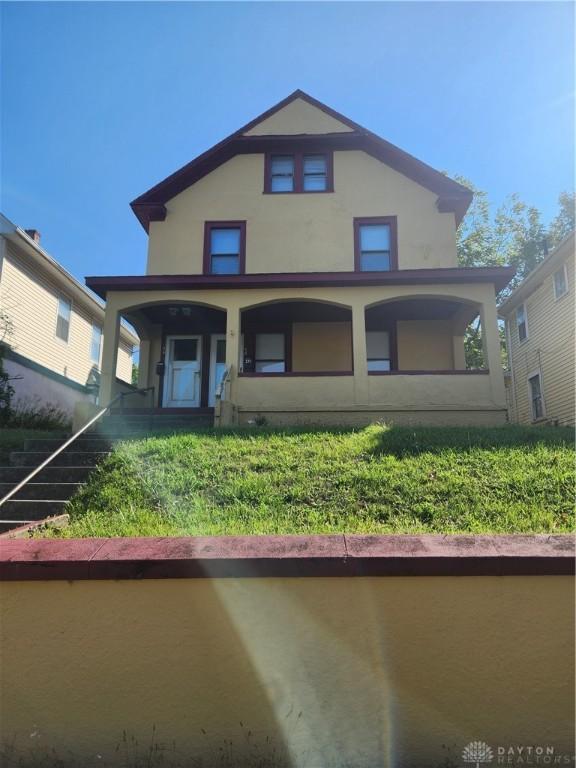 rear view of house with a porch