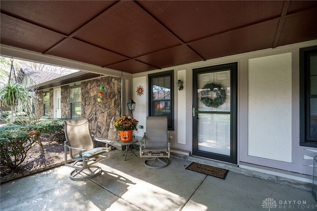 property entrance with a patio