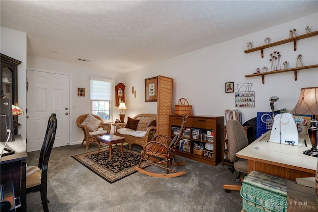 home office featuring a textured ceiling and carpet flooring