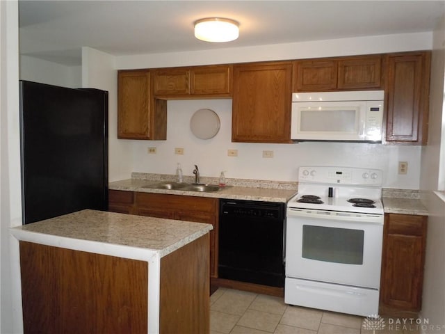 kitchen featuring black appliances, light tile patterned flooring, and sink