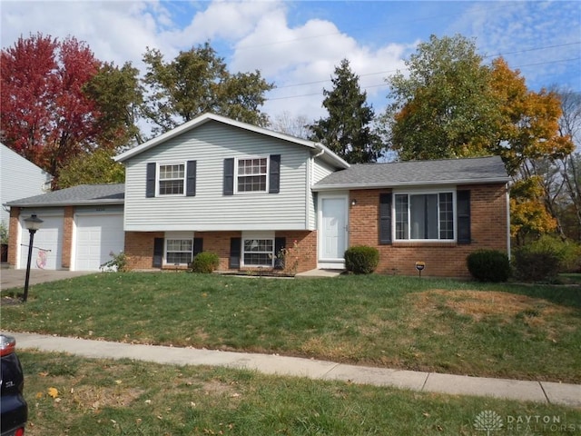 tri-level home with a front yard and a garage