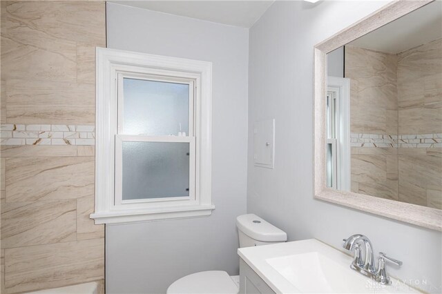 bathroom featuring toilet and vanity