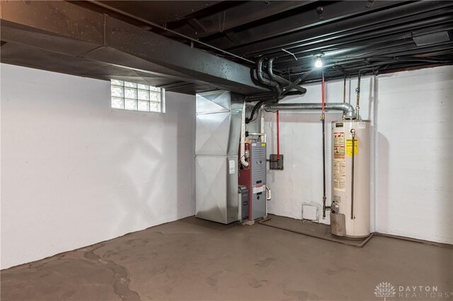 basement with water heater and heating unit