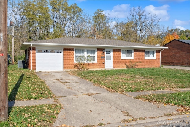 single story home with central AC unit, a garage, and a front lawn