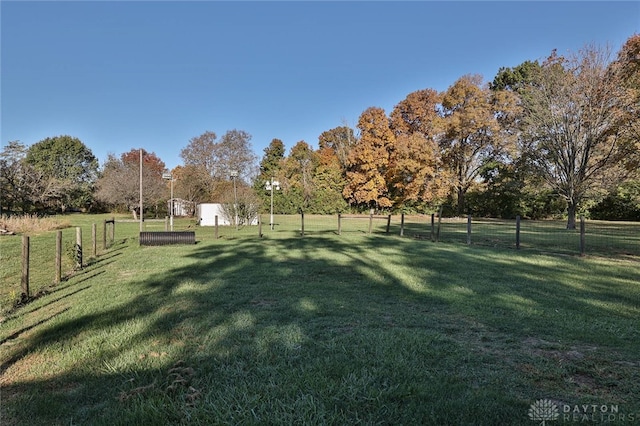 exterior space with a yard and a rural view