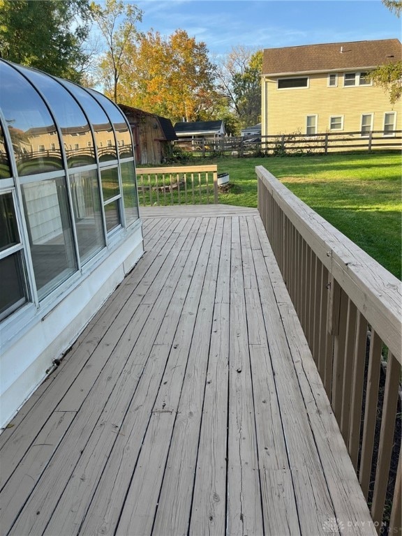 wooden terrace with a yard