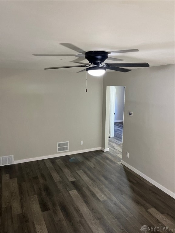 empty room featuring dark wood-type flooring