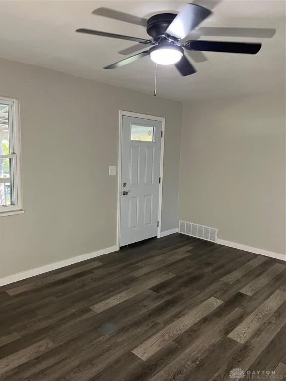 entrance foyer with dark hardwood / wood-style floors and ceiling fan