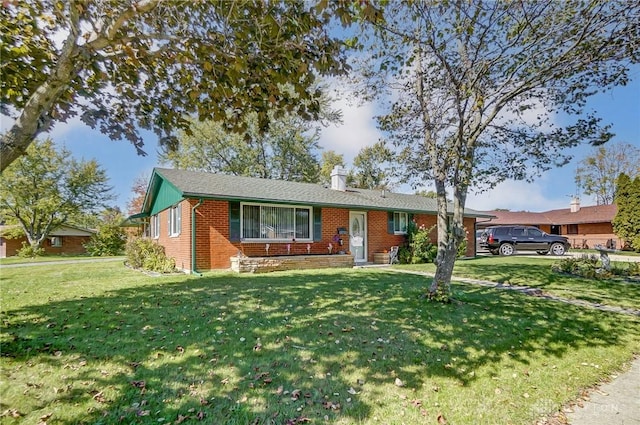 single story home featuring a front lawn