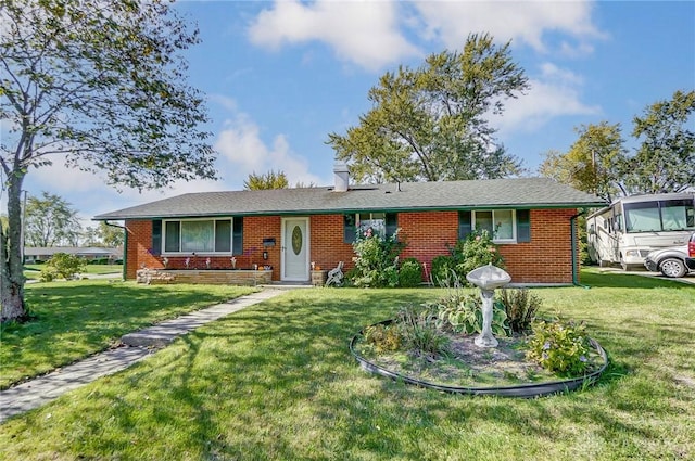 ranch-style home featuring a front yard