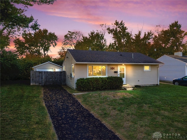 view of front of house with a yard