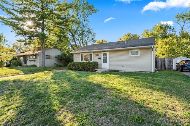 single story home with a front lawn